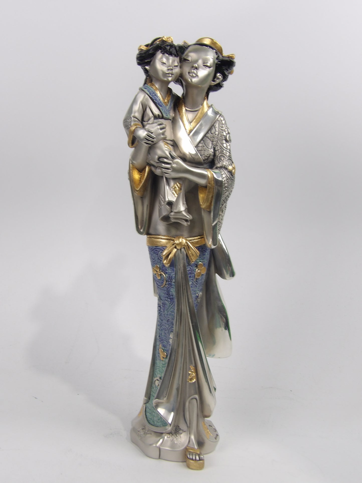 Asian Lady Holding a Girl – Silver Resin with Gold and Color Details
