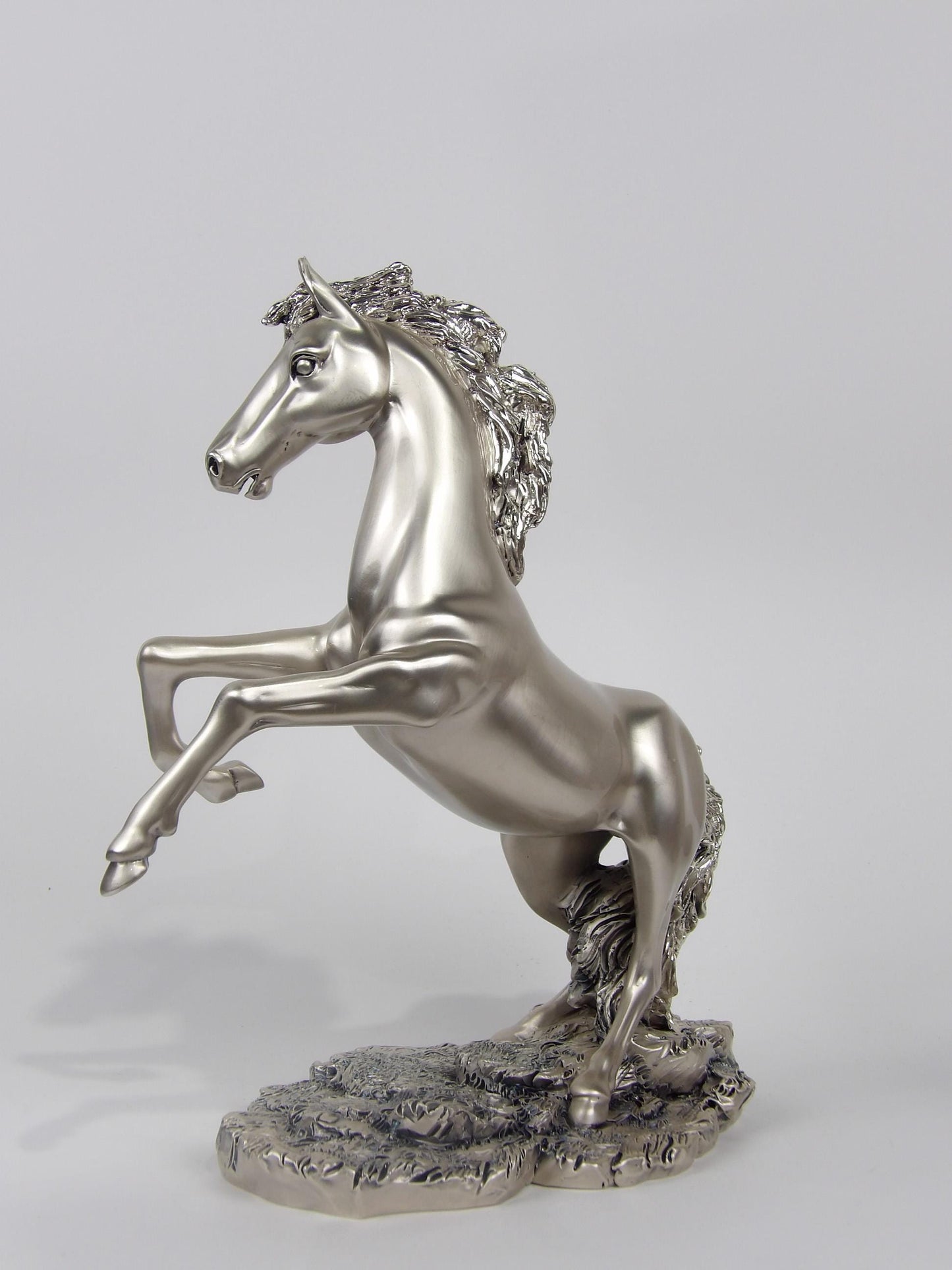 silver-coated resin sculpture, subject “prancing horse"