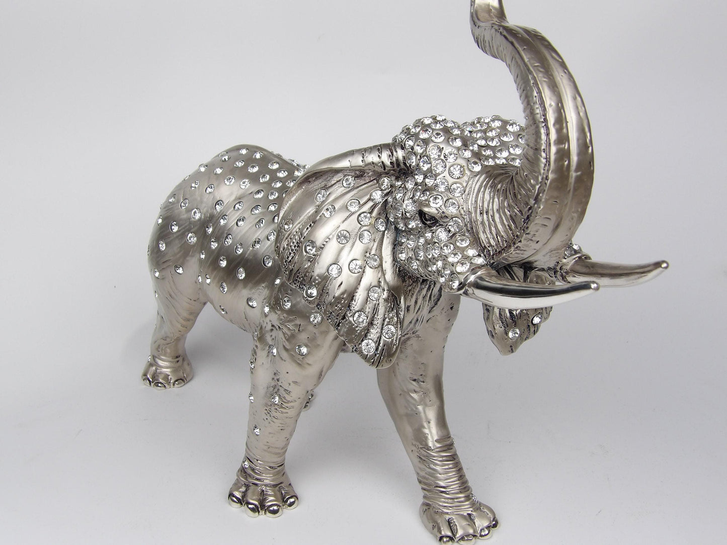 silver-coated resin sculpture with encrusted Swarovski rhinestones