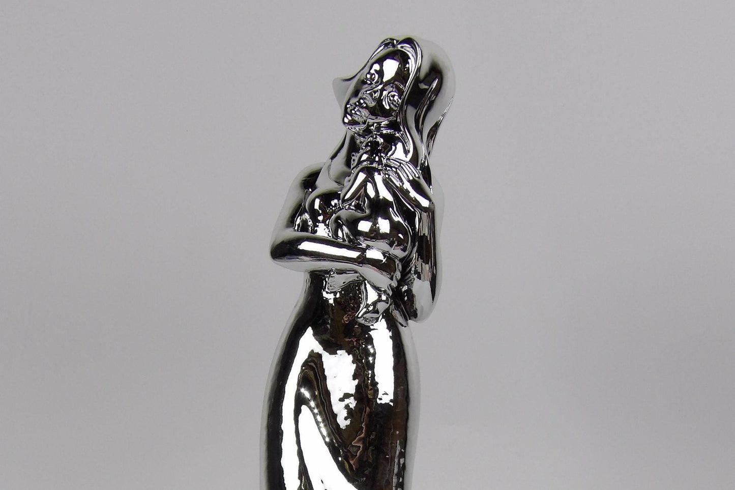 Silver-Coated Resin Sculpture of Woman Posing - Elegant and Timeless Decor