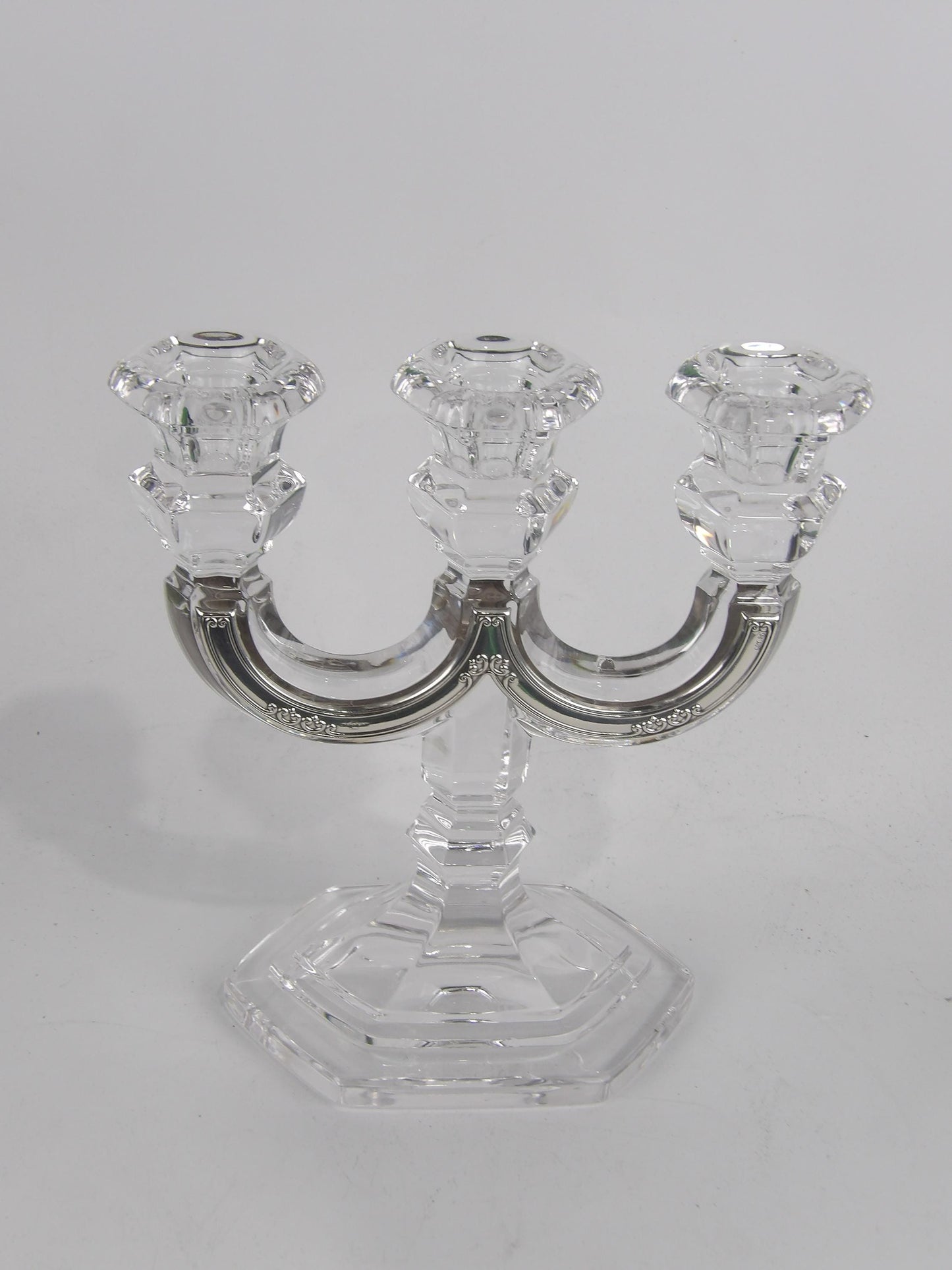 Crystal three-branched candelabra with trimming in silver-coated bilaminate