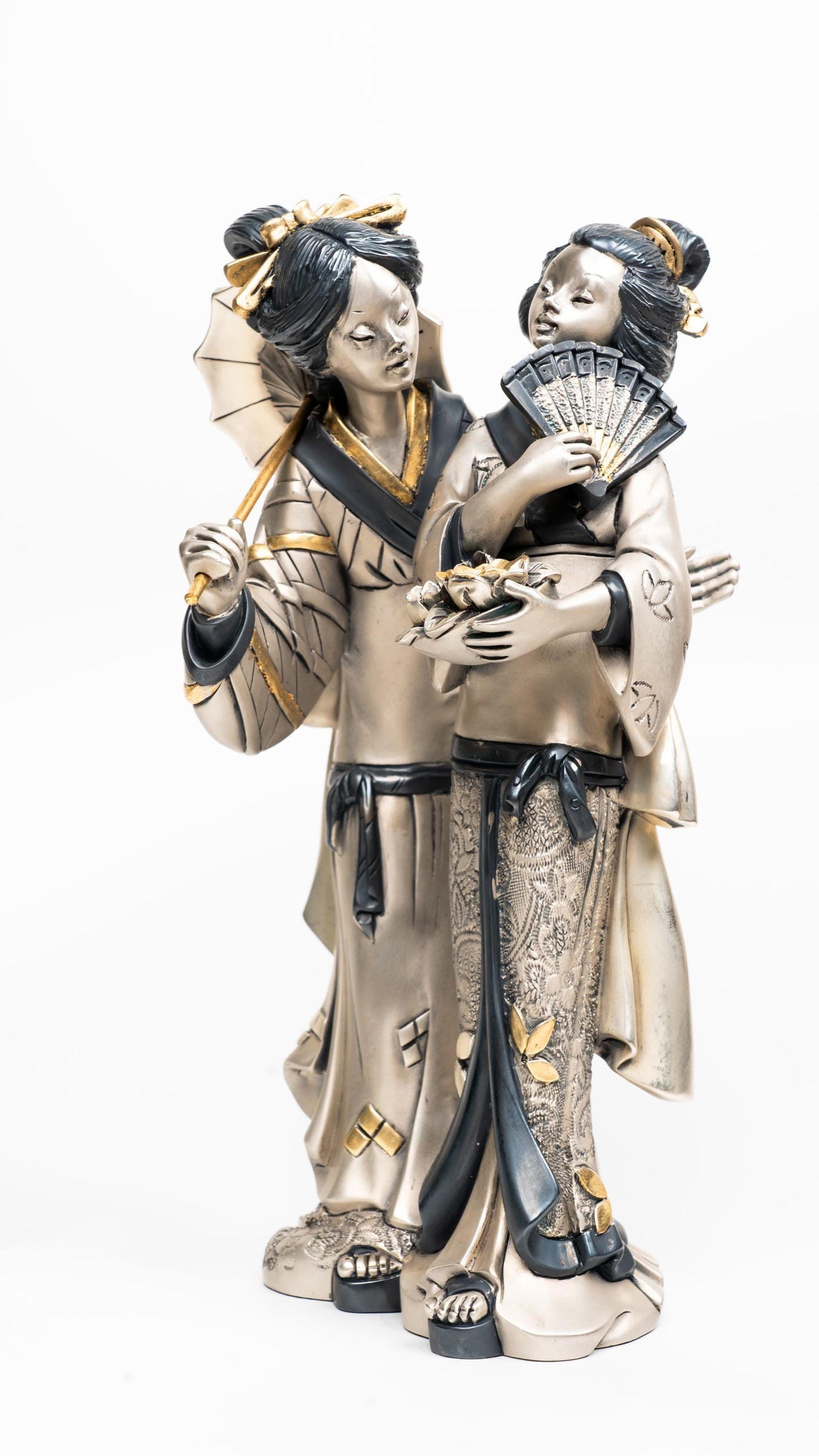 Two Geishas with silver resin and golden details