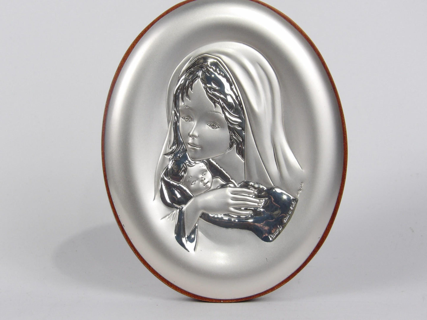 Mary with Baby in Oval Silver Laminate and mahogany base