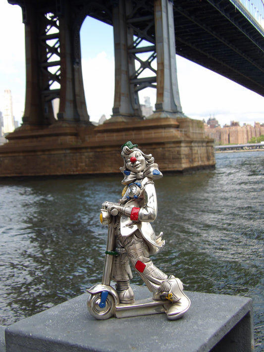 Silver-coated colored resin clown with push scooter