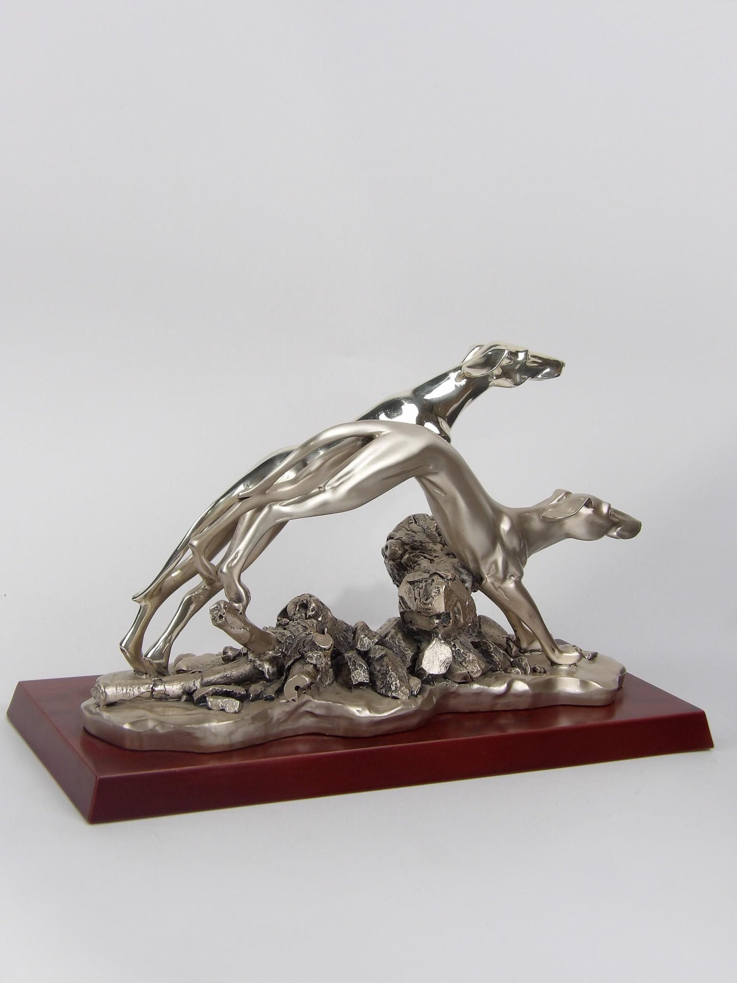 Silver-coated resin statue “pair of greyhound” on brown veneered