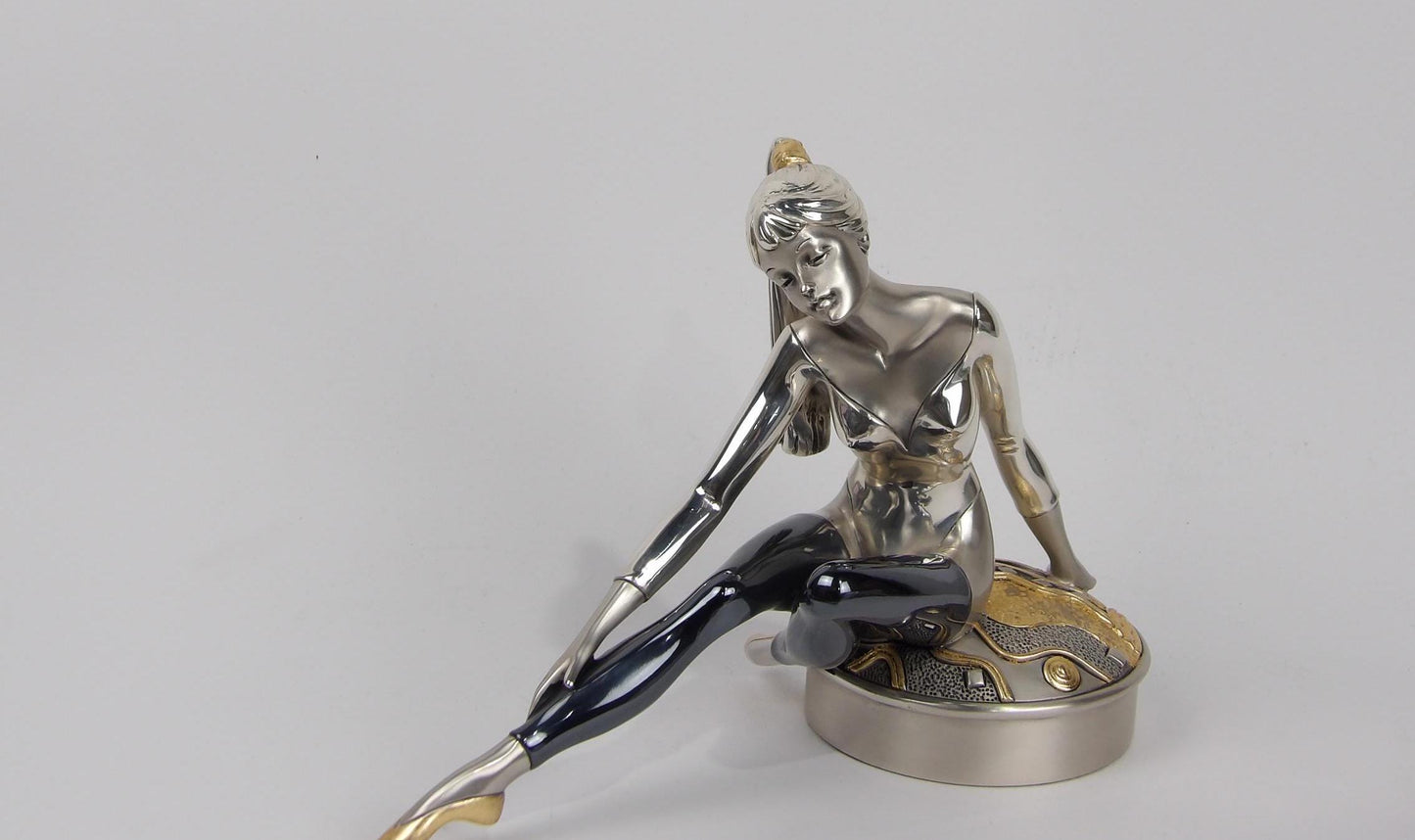Statue of Ballerina Above Pillow in Silver with Gold and Black Details - Graceful and Elegant Decor