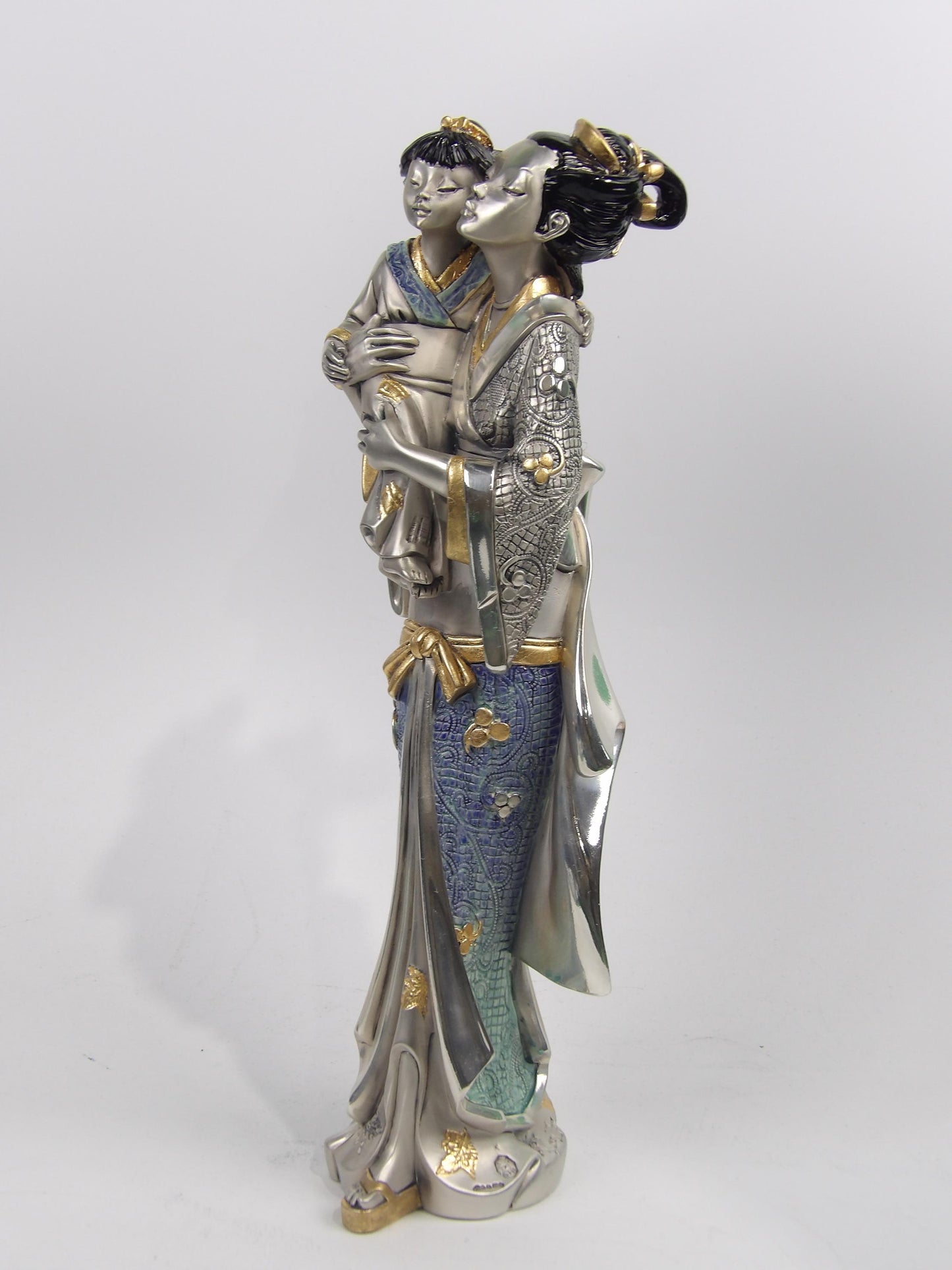 Asian Lady Holding a Girl – Silver Resin with Gold and Color Details