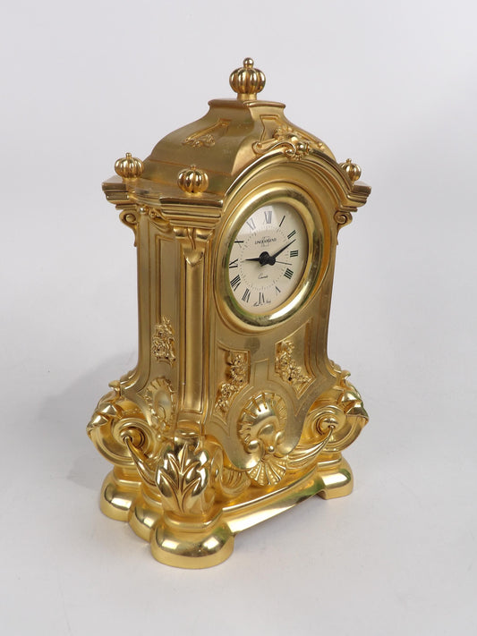Elegante reloj de mesa en resina dorada
